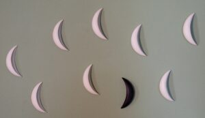 Crescent shapes on green background