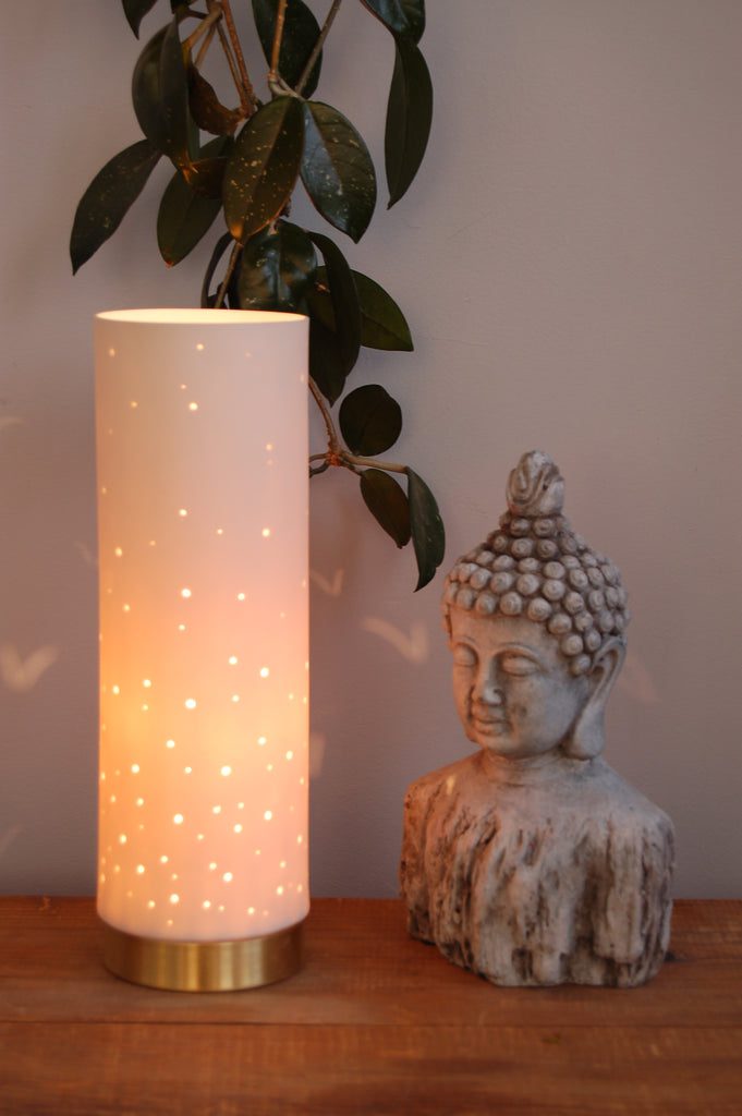 Buddha statue with illuminated lamp