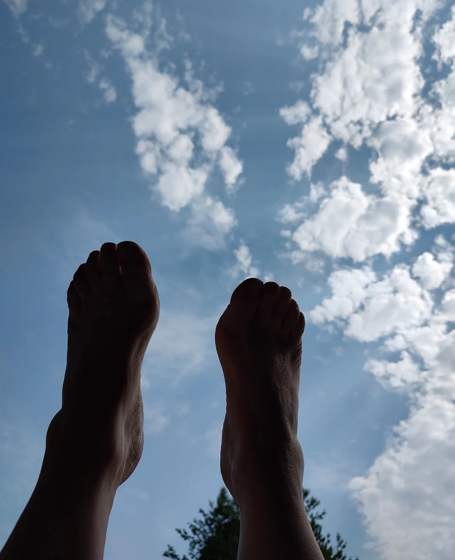 Skyward view with feet and clouds