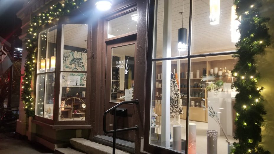 Holiday-themed storefront with glowing lights
