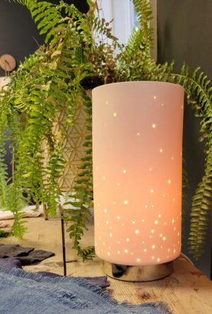 Glowing lamp with starry design