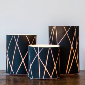 Contemporary lamps on wooden surface