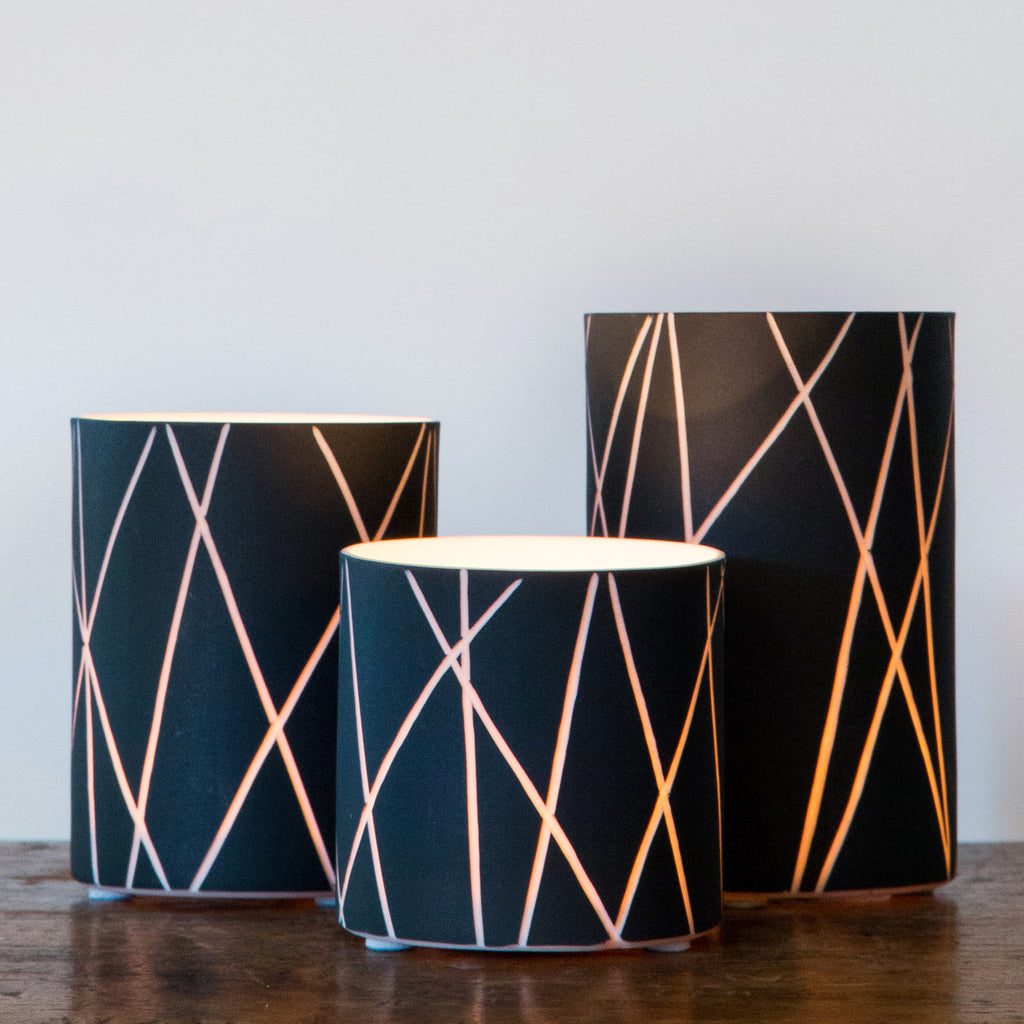 Contemporary lamps on wooden surface