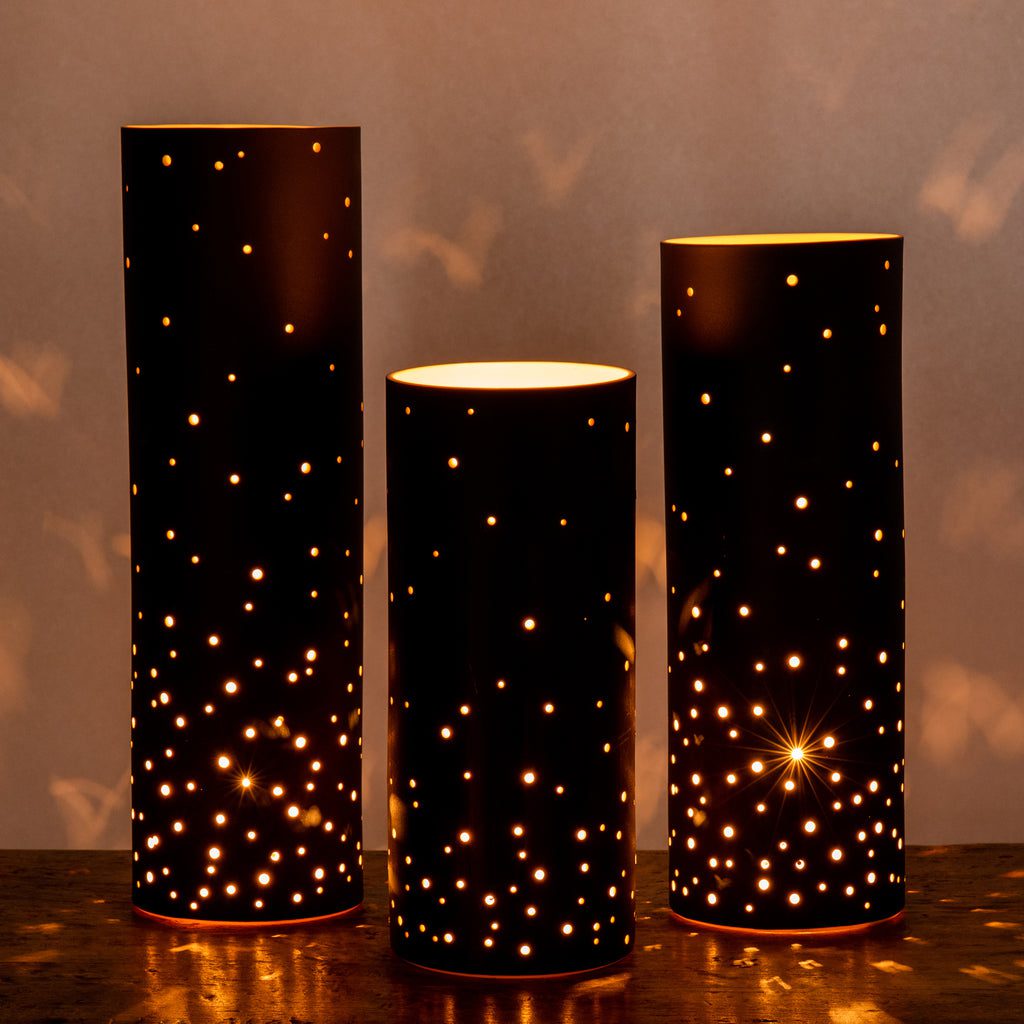 Cylindrical lanterns with starry light patterns