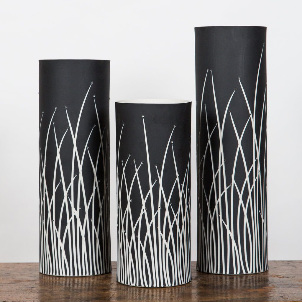 Black vases with white grass patterns