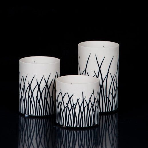 Elegant vases featuring abstract black patterns.