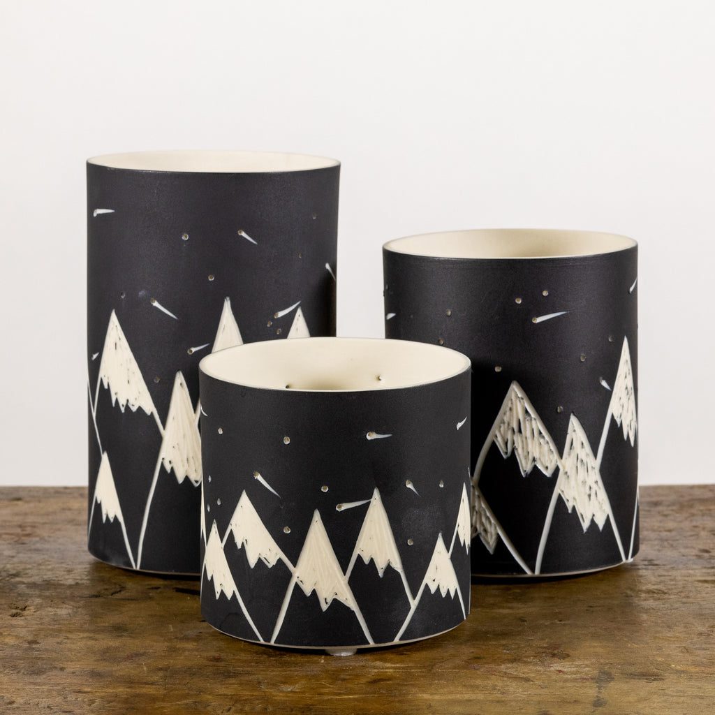 Trio of mountain-design vases