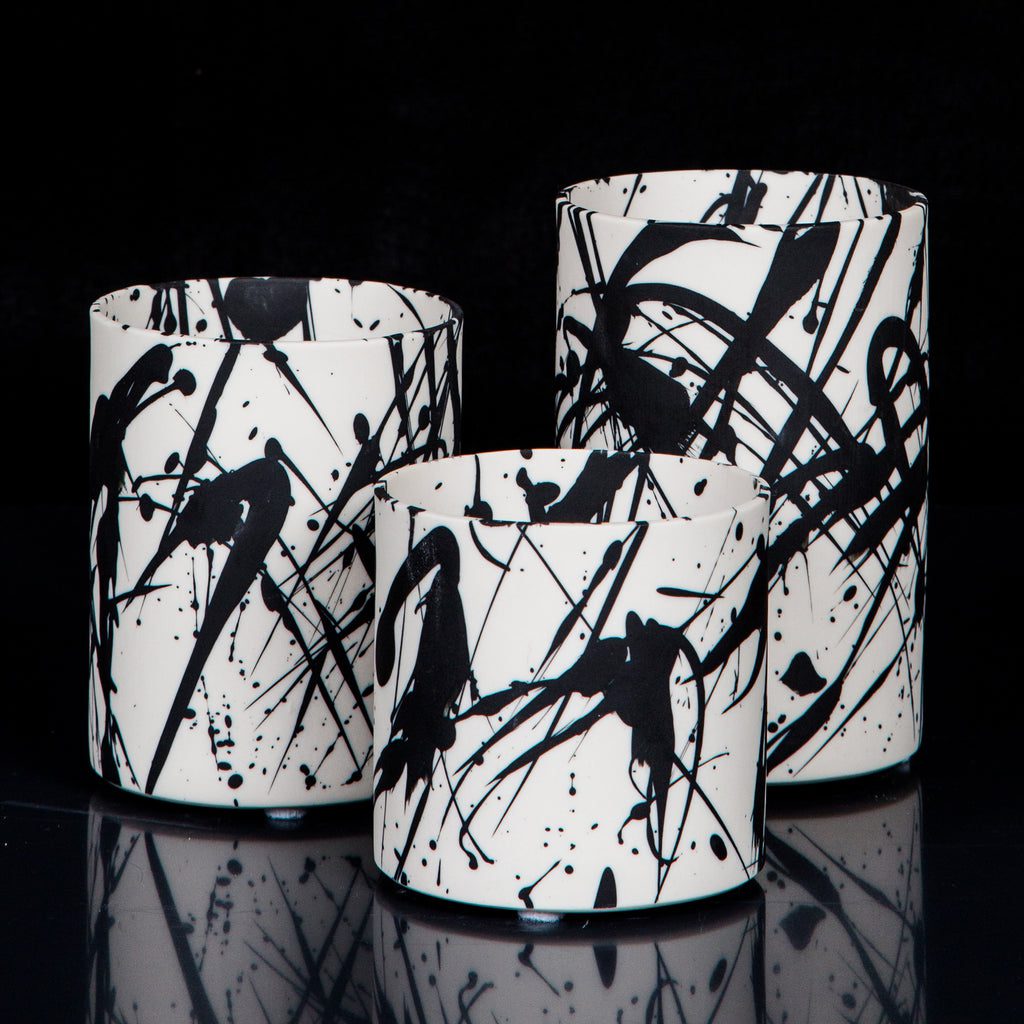 Three splattered-pattern ceramic vases