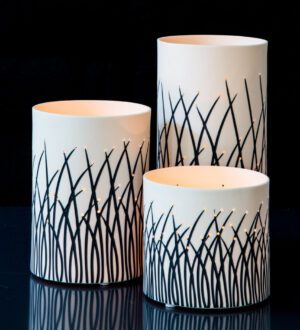 Trio of artistic black and white vases