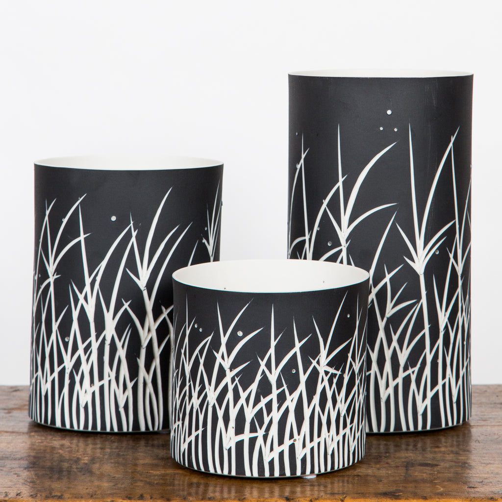 Black and white cylindrical plant pots