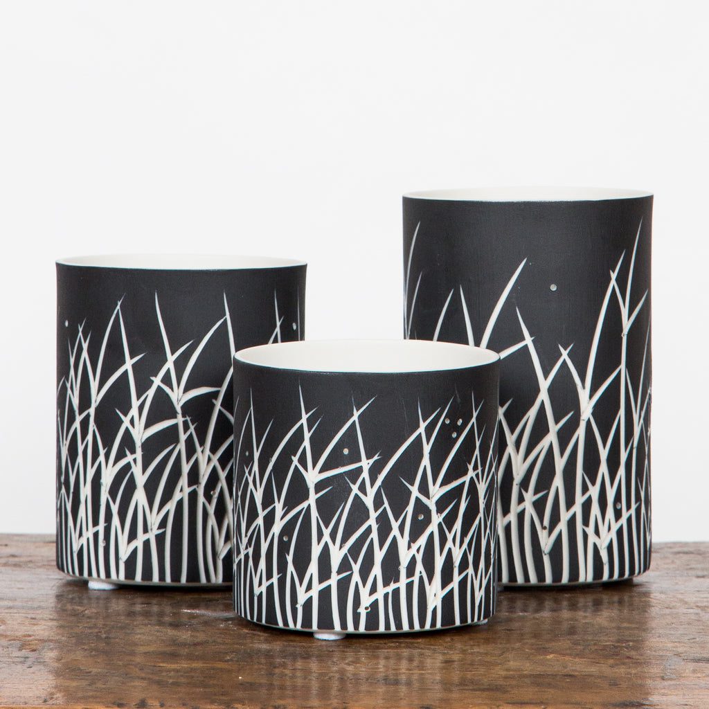 Trio of decorative cylindrical vases