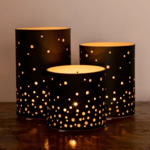 Decorative candle holders with star patterns