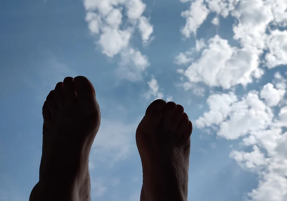 Skyward view with feet and clouds